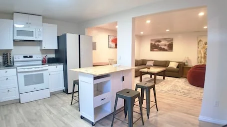 3-bed/2 bath basement apt. in charming Midvale with AC, wifi, laundry & hot tub.