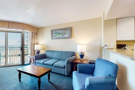 7th floor ocean-view condo with balcony, W/D & AC – direct beach access