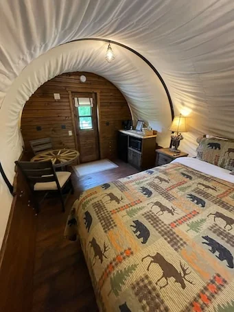 California Trail Wagon includes 1 king bed, bathroom w/ shower, heat & a/c, smart tv, wi-fi, microwa