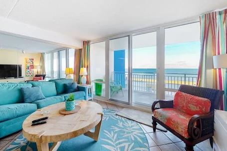 Oceanfront coastal condo with balcony, pools, sauna, gym, A/C, & WiFi